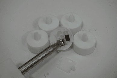 Each of the recalled Besslly tea lights has three preinstalled button cell batteries