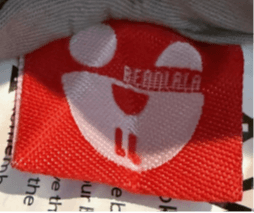 "Bearlala" is printed on an attached label on the outside of the recalled baby lounger's cover