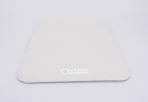 Infant side of Recalled Modera Organic Cotton Pack N Play Mattress Dual-Sided Portable Baby Crib Pad