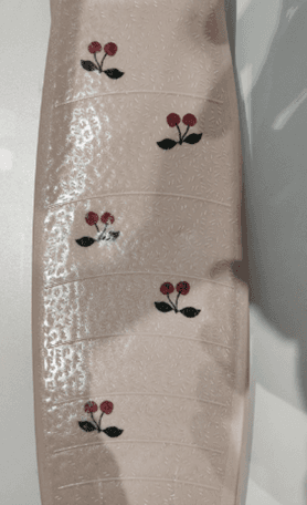 Close-up of Cherry print on the Recalled Konges Sløjd Scooter – model KS101544-P00005