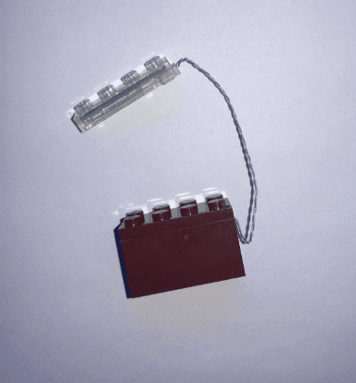 Recalled Cubimana Treehouse Building Set - brown building piece with a LED light that uses a button cell battery